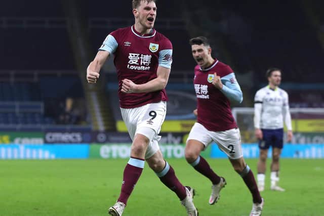 Chris Wood of Burnley celebrates after scoring their sides third goal during the Premier League match between Burnley and Aston Villa at Turf Moor on January 27, 2021 in Burnley, England.