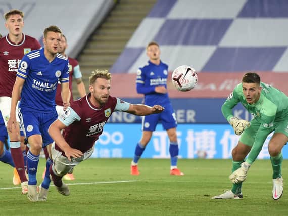 Burnley's English defender Charlie Taylor heads the ball away during the English Premier League football match between Leicester City and Burnley at King Power Stadium in Leicester, central England on September 20, 2020.