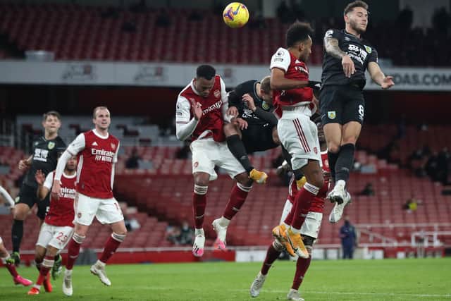 Pierre-Emerick Aubameyang heads the ball into his own net to put Burnley ahead at the Emirates Stadium in December.