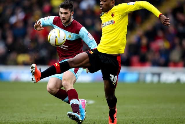 Nathaniel Chalobah of Watford is put under pressure by Charlie Austin of Burnley during the npower Championship match between Watford and Burnley at Vicarage Road on March 29, 2013 in Watford, England.