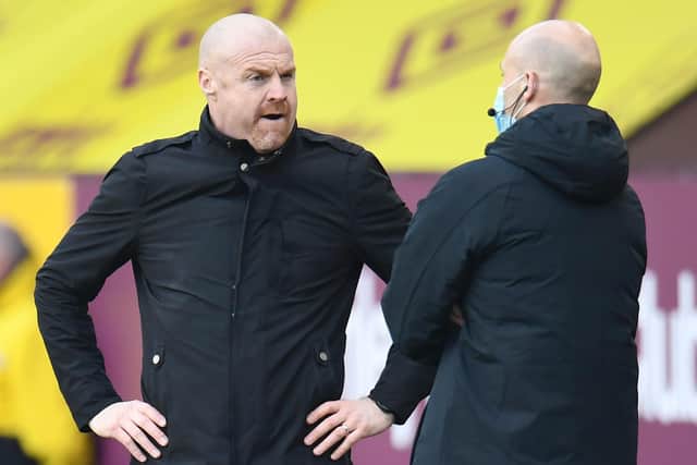 Burnley's English manager Sean Dyche (L) talks to the fourth official during the English Premier League football match between Burnley and Arsenal at Turf Moor in Burnley, north west England on March 6, 2021.