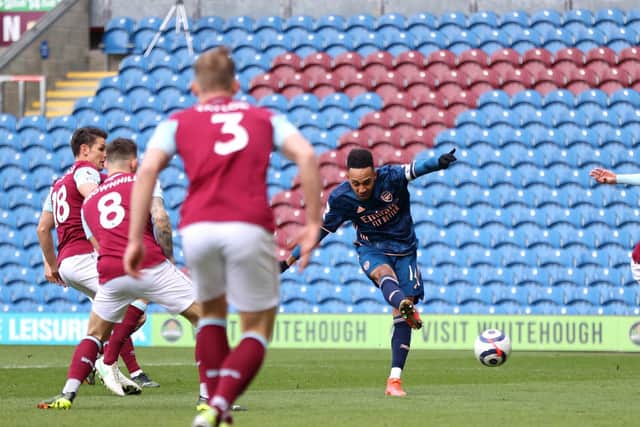 Pierre-Emerick Aubameyang of Arsenal scores his team's first goal during the Premier League match between Burnley and Arsenal at Turf Moor on March 06, 2021 in Burnley, England.
