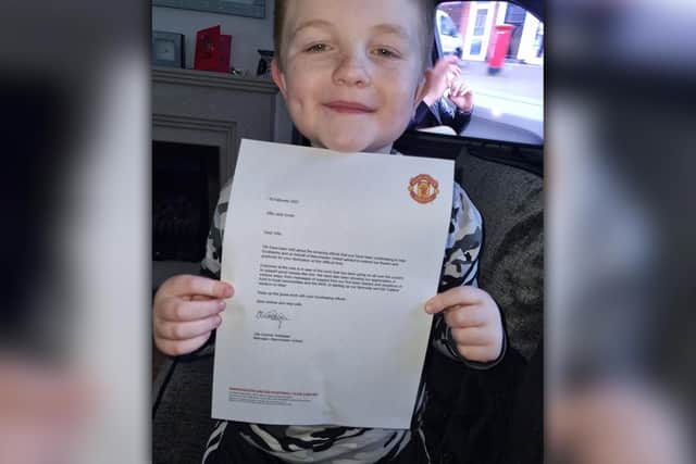 Proud Alfie shows off the letter he received from Man Utd boss Ole Gunnar Solskjær