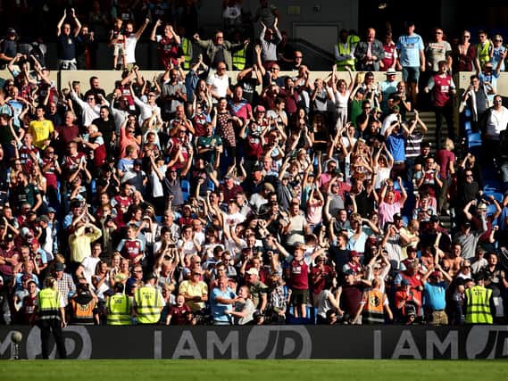 Burnley fans show their support after the Premier League match between Brighton & Hove Albion and Burnley FC at American Express Community Stadium on September 14, 2019 in Brighton, United Kingdom.