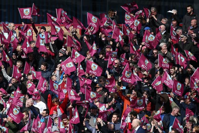 Burnley fans show their support during the Premier League match between Burnley FC and Cardiff City at Turf Moor on April 13, 2019 in Burnley, United Kingdom.