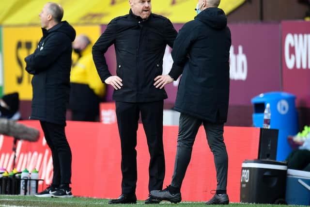 Sean Dyche, Manager of Burnley confronts fourth official Anthony Taylor during the Premier League match between Burnley and Arsenal at Turf Moor on March 06, 2021 in Burnley, England.