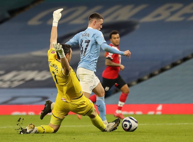 Phil Foden is brought down by Alex McCarthy