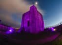 The historic castle looked amazing lit up purple. Picture by Kelvin Stuttard