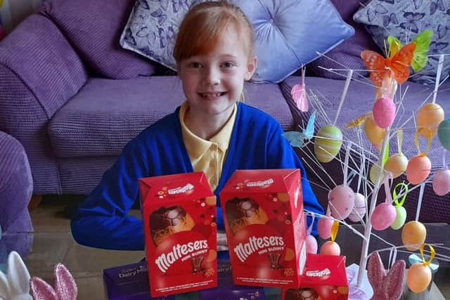 Elsie Whitehall (eight) with some of the Easter egg donations for the Burnley Community Kitchen