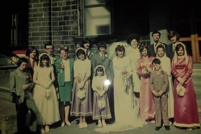 One of the few snaps from their wedding day the Taylors have. Do you recognise anyone here?