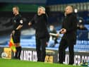 Everton's Italian head coach Carlo Ancelotti reacts as Burnley's English manager Sean Dyche looks on during the English Premier League football match between Everton and Burnley at Goodison Park in Liverpool, north west England on March 13, 2021.