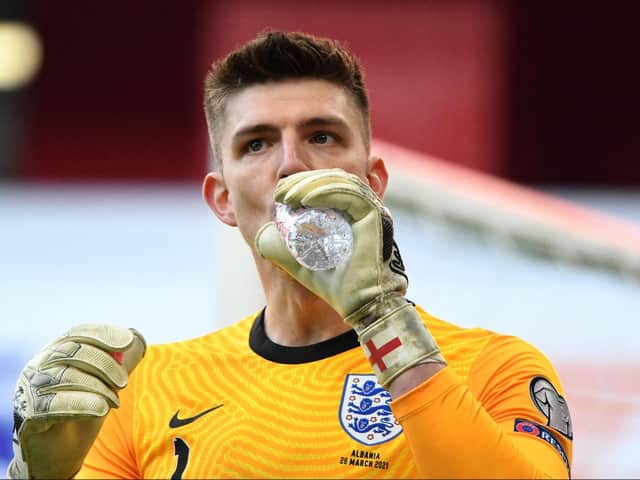 Nick Pope takes a drink in Albania