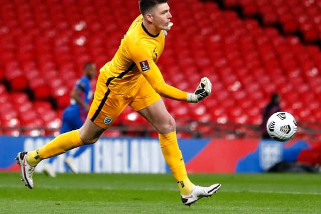 Nick Pope of England rolls the ball out during the FIFA World Cup 2022 Qatar qualifying match between England and San Marino at Wembley Stadium on March 25, 2021 in London, England.