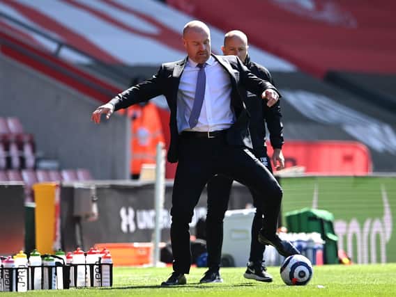 Sean Dyche, Manager of Burnley controls the ball during the Premier League match between Southampton and Burnley at St Mary's Stadium on April 04, 2021 in Southampton, England.