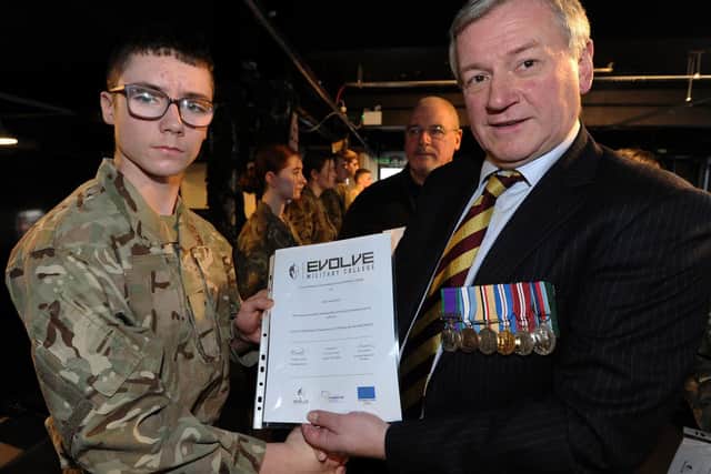 Joel Fallows receives his certificate from Lt Col (retired) David Cooke