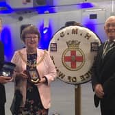 The Mayor of Burnley Coun. Anne Kelly presenting the Captain of HMS Prince of Wales Darren Houston (right) with civic gifts, watched by the Mayor's Consort Mr John Kelly