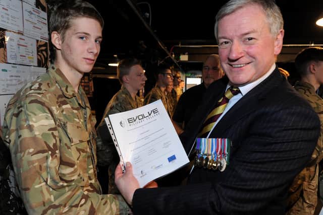 Edgar Murray receives his certificate from Lt Col (retired) David Cooke