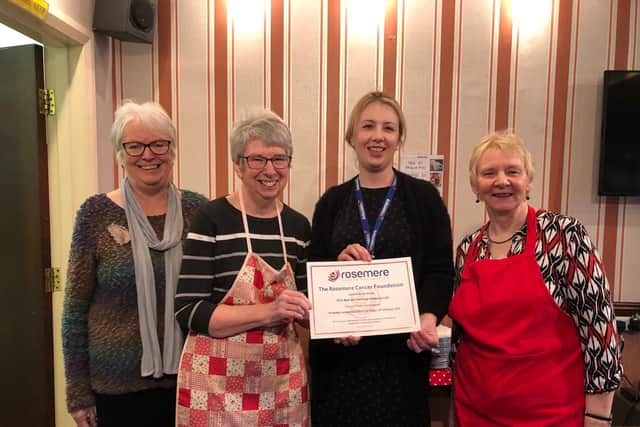 Charity volunteer Kathy Webb with Read and Simonstone Community Cafs Ann  Wild and Marie Hacking and Rosemere Cancer Foundations Louise Grant (second from right)