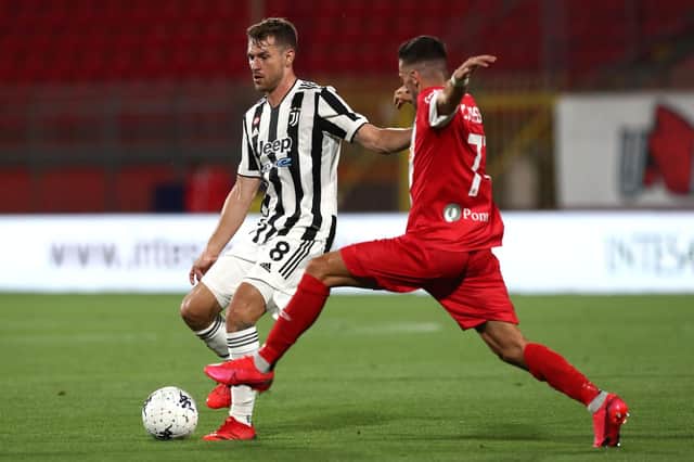 Aaron Ramsey of Juventus FC competes for the ball with Jose’ Machin of AC Monza during the AC Monza v Juventus FC - Trofeo Berlusconi at Stadio Brianteo on July 31, 2021 in Monza, Italy.