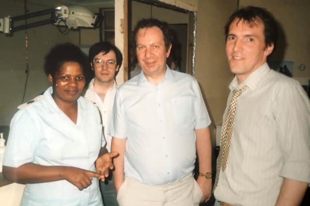Former Burnley MP Peter Pike, who died last week at the age of 84, with his friends and fellow politician Alistair Burt (left) and Simon Hughes with a nurse at Crossroads  clinic in Cape Town,  South Africa in 1986