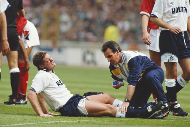 Spurs' Paul Gascoigne receives treatment before being stretchered off after fouling Nottingham Forest's Gary Charles during the 1991 FA Cup Final
