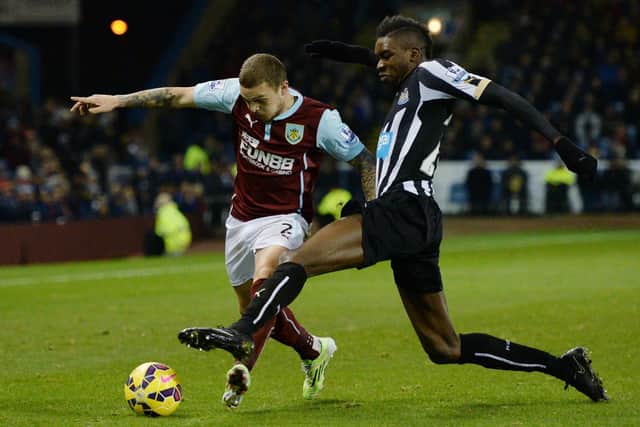 Newcastle United's English striker Sammy Ameobi vies for the ball with Burnley's English defender Kieran Trippier duringduring the English Premier League football match between Burnley and Newcastle United at Turf Moor in Burnley, north west England, on December 2, 2014.