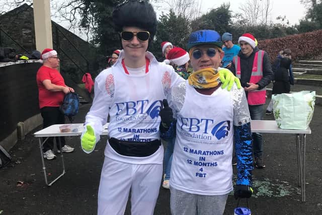 Andrew Read (right) with his nephew George (18) in fancy dress for their festive marathon