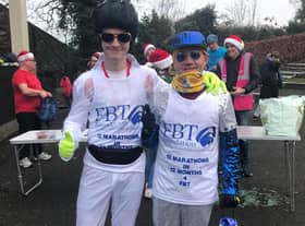Andrew Read (right) with his nephew George (18) in fancy dress for their festive marathon