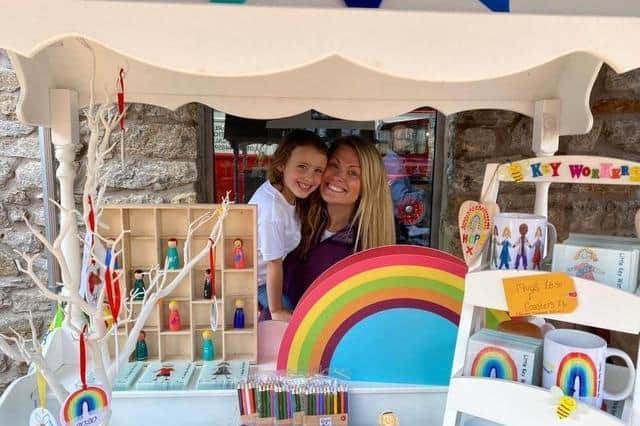 Annie and Victoria Bond selling some of their Little Keyworker Co products at the beginning of their journey