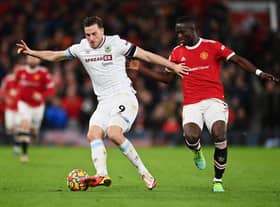 Chris Wood of Burnley holds off Eric Bailly of Manchester United during the Premier League match between Manchester United and Burnley at Old Trafford on December 30, 2021 in Manchester, England.