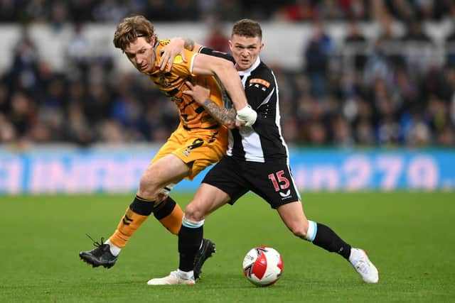 Cambridge striker Joe Ironside is challenged by Kieran Trippier of Newcastle during the Emirates FA Cup Third Round match between Newcastle United and Cambridge United at St James' Park on January 08, 2022 in Newcastle upon Tyne, England.