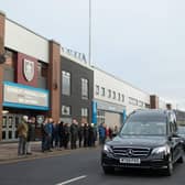Mourners pay their respects as Mr Pike's funeral passes Turf Moor in recognition of his loyalty to the Clarets