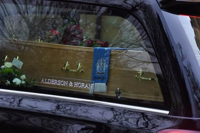 The moving image of his Clarets scarf draped over Mr Pike's coffin.