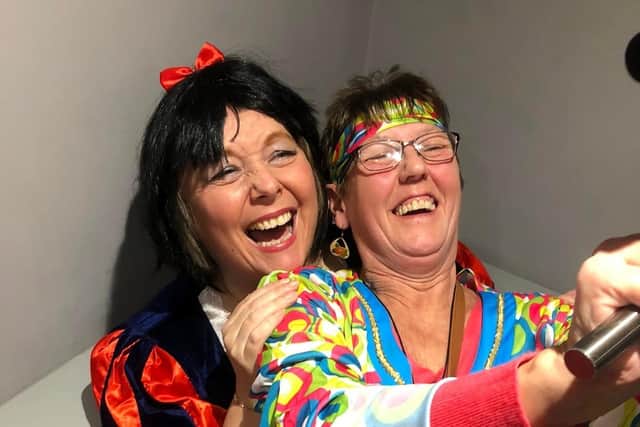 A celebration 'selfie' for two pals at the fancy dress party to mark the end of lockdown