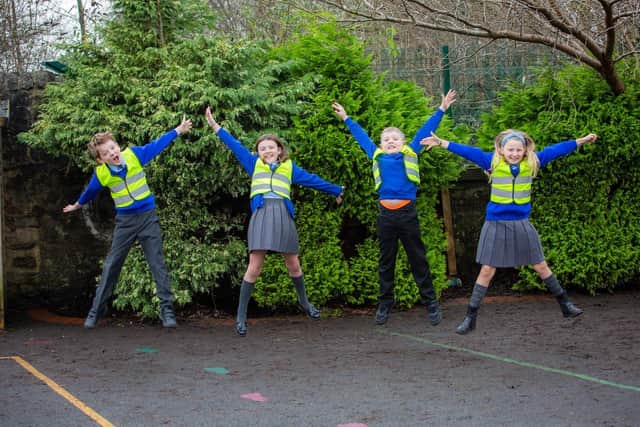 Youngsters thrilled to wear their new hi-vis vests