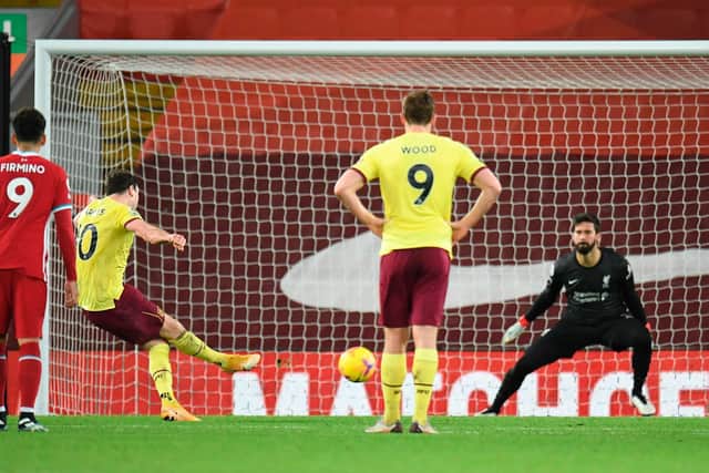Burnley's English striker Ashley Barnes (2L) scores the opening goal from the penalty spot during the English Premier League football match between Liverpool and Burnley at Anfield in Liverpool, north west England on January 21, 2021.