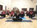 Samantha Slade leads the men's Yoga For Sport class