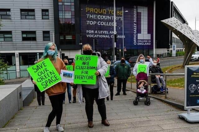 Protestors pictured during a peaceful demonstration against Burnley College's expansion plans in the summer last year