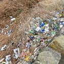 The trail of  litter on the Burnley embankment