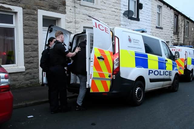 A man was arrested and several mobile phones were seized in Burnley following early morning raids as part of a major national operation targeting fraud and money laundering.