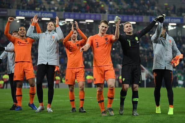 Virgil van Dijk and Wout Weghorst, far left