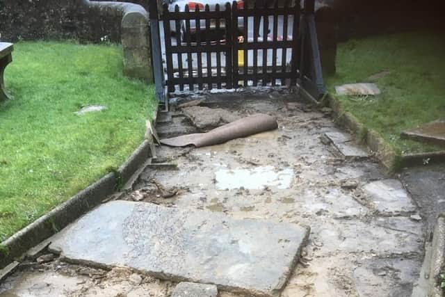 The shocking sight of St Ambrose Church in Grindleton after thieves made off with stone slabs from the pathway