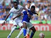 Burnley's Ivorian defender Maxwel Cornet (L) vies with Leicester City's Nigerian midfielder Wilfred Ndidi during the English Premier League football match between Leicester City and Burnley at King Power Stadium in Leicester, central England on September 25, 2021.