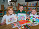 Burnley pupils Elsie Whitehall, Harry Lambert and Ava Aspden with their winning entries