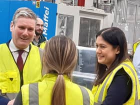 Labour leader Sir Keir Starmer and Shadow Levelling up Secretary Lisa Nandy chat to a worker at What More