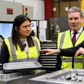 Lisa Nandy MP and Labour leader Sir Keir Starmer chat with a worker at What More
