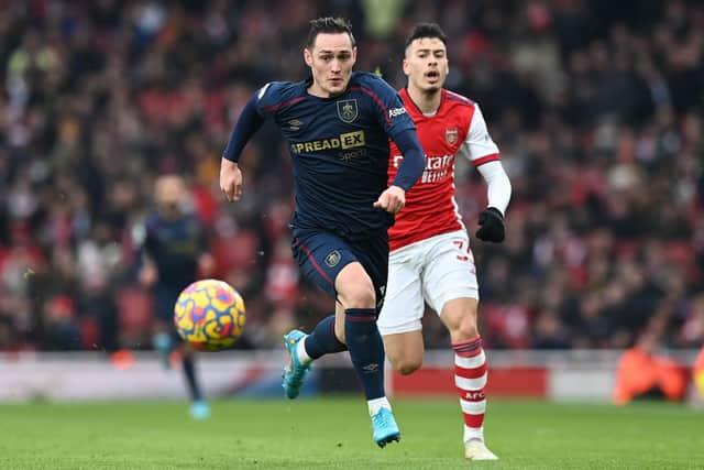 Burnley's Welsh defender Connor Roberts (L) runs away from Arsenal's Brazilian striker Gabriel Martinelli (R) during the English Premier League football match between Arsenal and Burnley at the Emirates Stadium in London on January 23, 2022.