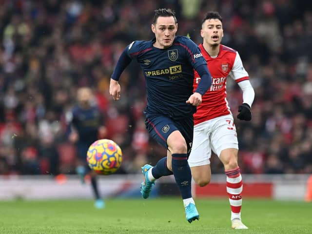 Burnley's Welsh defender Connor Roberts (L) runs away from Arsenal's Brazilian striker Gabriel Martinelli (R) during the English Premier League football match between Arsenal and Burnley at the Emirates Stadium in London on January 23, 2022.