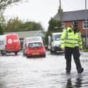 Scenes of flooding in Lancashire in early November last year, which forced police to close roads across the county