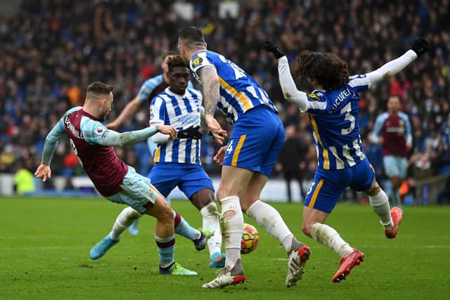 Josh Brownhill of Burnley scores their side's second goal during the Premier League match between Brighton & Hove Albion and Burnley at American Express Community Stadium on February 19, 2022 in Brighton, England.